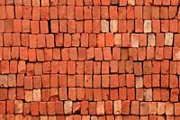 Brick Pattern. Stack of fresh processed bricks loosely stacked horizontally.