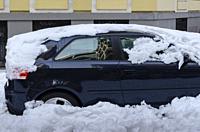 Madrid, Spain. 10 th January 2021. View of a car in San Bernardo street, Chamberi quarter, after Filomena snow storm.