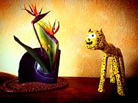 A paper mache jaguar and a crane flower or bird of paradise decorate a home in Mexico City, Mexico