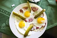 Czech breakfast. Eggs, bacon and pickles.