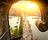 View on Charles Bridge in Prague at sunset from above.