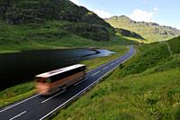 Bus on mountains road in Scotland. Road A83 Argyll and Bute.