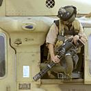 IRAQ Taneem -- 08 Apr 2003 -- A door gunner of a USAF HH-60G Pave Hawk helicopter - a flight engineer from the 301st Rescue Squadron prepares for a mi...