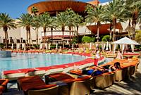 Guests relax by the swimming pool at the Red Rock Casino Resort and Spa in Las Vegas, Nevada.