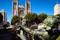 Grace Cathedral towers beside Hunting Park in San Francisco, California.