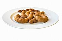 Sweet tamarind on a plate and white background.