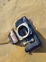 Nikon retro classic SLR film camera on beach