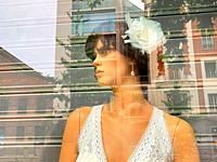 Mannequin wearing wedding dress in a shop window. Madrid, Spain.