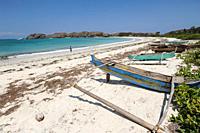Lombok, West Nusa Tenggara, Indonesia, Asia - Traditional wooden fishing boats on the shore of the pristine white sandy Tanjung Aan Beach near the sma...