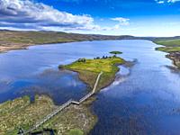 Aerial view form drone of Finlaggan historical monument site on Eilean Mòr on Loch Finlaggan, Islay, Inner Hebrides, Scotland, UK.