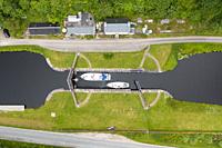 Aerial view from drone of Crinan Canal at village of Cairnbaan in Argyll & Bute, Scotland, UK.