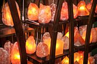 Shelves full of Himalayan salt lamps of all shapes and sizes ready to be sold.