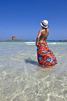 Woman at La Pelosa beach, Sardinia, Italy.