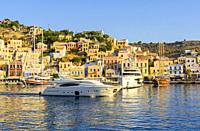 Luxury boats in the harbour of Yialos Town, on the island of Symi, Dodecanese, Greece.