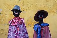 Traditionally dressed mannequins outside of the La Merced Convent, Antigua, Guatemala,.