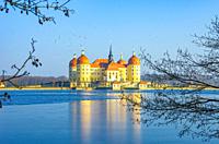 Moritzburg near Dresden, Saxony, Germany: Wintry Moritzburg Palace from the Northwest, surrounded by the partially frozen palace pond.