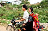 Space for a whole family on a small motorbike: Street scene in Sapa, Vietnam