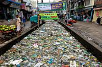 Bangladesh â. “ October 19, 2021: The mouth of the canal is blocked by piles of plastic waste and food waste dumped in the city of Jatrabari, Dhaka.