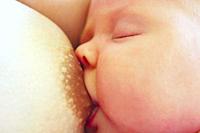 mother breastfeeding baby who fell asleep during this.