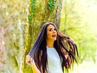 Young woman is excited surprised in nature.