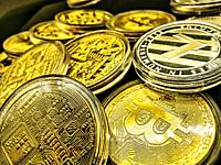 Hands full of Bitcoins. BItcoins are a cryptocurrency, a type of digital currency, and a payment system without a central bank or sole administrator. ...