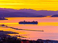 Dawn scenery MAERSK ship enters harbor Rijeka in Croatia Europe.