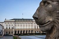 Lion statue in front of classicist style Presidential Palace with Jozef Poniatowski statue on the Krakowskie Przedmiescie street in Warsaw, capital of...