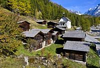 Wooden stables and storage houses in the hamlet Kühmad near the pilgrimage chapel, view at the Loetschenluecke Pass, Blatten, Lötschental, Valais, Swi...