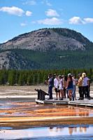 People On Boardwalk Near Grand Prismatic Spring In Yellowstone National Park, Wyoming, USA.
