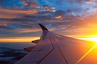 Zurich, Switzerland, Europe - Flying with Singapore Airlines from Singapore to Zurich at a beautiful sunrise with aerial view from the airplane of win...