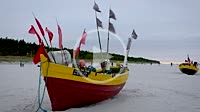 Fishing boats on a beach in Debki village over Baltic Sea in Poland