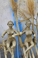 India, Uttar Pradesh, Varanasi, Holika clay statues meant to be burnt on the eve of Holi festival.