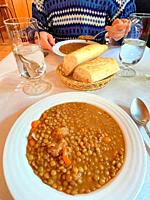 Eating lentils stew. Spain.