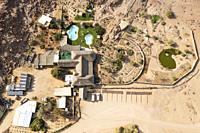 The Brandberg White Lady Lodge in the vicinity of the Ugab river. Aerial view. Drone shot. Damaraland, Erongo Region, Namibia.