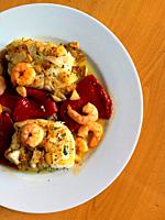 Hake loin with prawns, Piquillo peppers, garlic, onion and oregano. Spain.