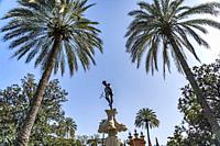Neptune Fountain at the gardens adjoining the Royal Alcázar of Seville, Andalusia, Spain.