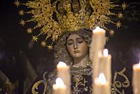 Detail of sculpture of virgin crying with candles lit in front, Easter, Holy Week, Spain.