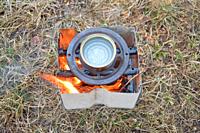 Metal stove for burning wood chips and a firewood.