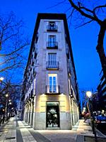 Facade of building, night view. Alcala street corner to Villanueva street, Madrid, Spain.