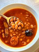Eating beans stew. Spain.