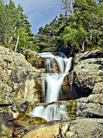 Upper section of huge waterfall of Sant Espirit flowing towards Estany Llebreta lake. Summer time at Aiguestortes National Park. Lleida province, Cata...