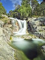 Upper section of huge waterfall of Sant Espirit flowing towards Estany Llebreta lake. Summer time at Aiguestortes National Park. Lleida province, Cata...