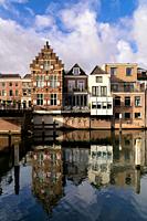View over the river Linge on some monumental buildings in the Dutch fortified town Gorinchem.