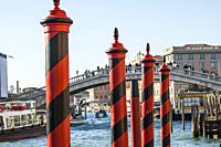 Venetian Paline de Casada (Venetian poles with stripes/mooring posts). The canals of Venice. Venice, Veneto Region, Italy, Europe.