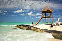 Tourists sunbathing at the sandy North beach area, Isla Mujeres, Cancun, Quintana Roo, Mexico, Central America.