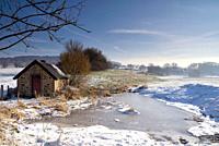 Shed in a winter landscape close to the Dutch village Epen in the province Limburg.