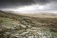 The eastern slope of Wansfell in late winter with Trout Beck Valley beyond in the Lake District National Park, Cumbria, England.