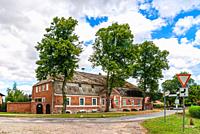 Nehringen, community of Grammendorf, Mecklenburg-Western Pomerania, Germany: The historic farm building of the Nehringen estate, part of the ensemble ...