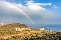Rainbow at Cala Carbon beach, Cabo de Gata natural park, Andalusia, Spain.