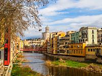 Colourful houses along the banks River Onyar in the old town of Girona - Spain.